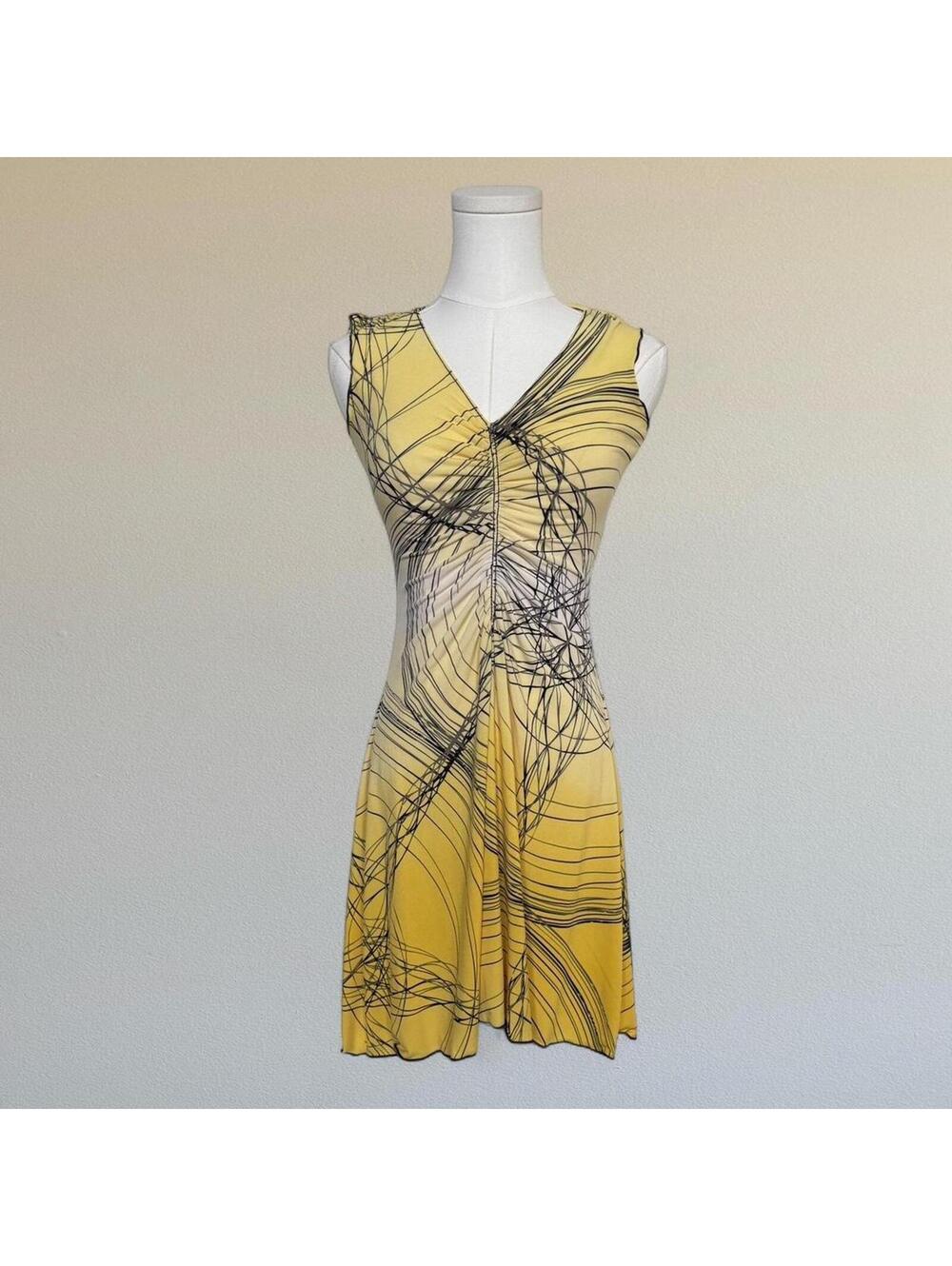Abstract print dress with ruched front. From Studio M in a size S.
